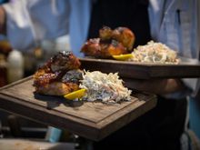 Cooked in a Southern barbecue-style jam and then charred, the juicy chicken is perfectly complemented by the crunchy slaw.   