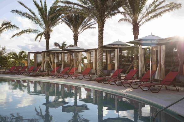 A tranquil pool at Kimpton Seafire Resort + Spa in Seven Mile Beach, Grand Cayman.
