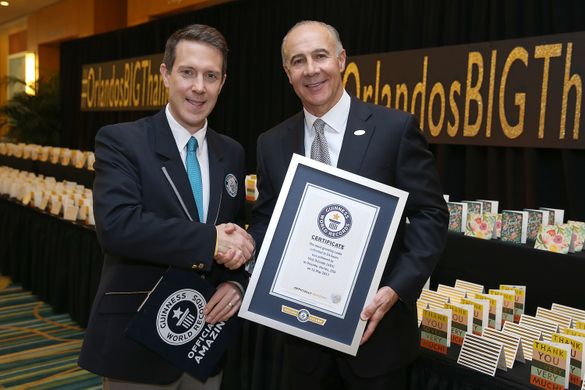 Philip Robertson, GUINNESS WORLD RECORDS adjudicator and George Aguel, President and CEO of Visit Orlando, celebrate the declaration of Visit Orlando as a GUINNESS WORLD RECORDS title holder as part of the launch of a new thank you campaign, on May 11 in 