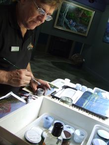 Tweed landscape artist, Andy Reimanis, at work on the Green Cauldron Panorama