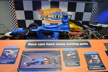 Chip Ganassi Racing has loaned a real life IndyCar that has been cut in half so visitors can see the inner workings and how an IndyCar is engineered. 