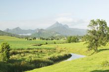 The tranquil Tweed River winds around the base of Mt  Warning in the Tweed Valley of northern NSW