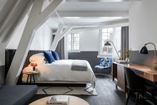 A light-filled guestroom at Kimpton De Witt Hotel in Amsterdam, Netherlands.