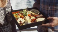 Guests on-board Schouten Passage II enjoy a Tasmanian Ploughman's lunch prepared by Freycinet Lodge