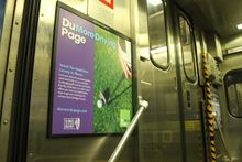 The new branding initiative includes Metra posters that emphasize DuPage County's green spaces.