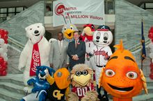 Atlanta Mayor Kasim Reed and ACVB President & CEO William Pate are joined by local mascots to celebrate the 40 million visitor m