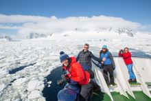 Photographers on board Polar Pioneer, Lemaire Channel, Antarctica
