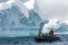 Photographers Zodiac cruising near Enterprise island in Antarctica