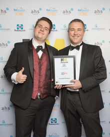 Justin McConnell, Hotel Manager, Next Hotel Brisbane (l.h.s.) receiving Best Tech Hotel from Brandon Evertz, CEO Big Review TV
