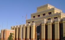 What’s behind the wall?  The 115-outlet store complex of Citadel Outlets,  modeled after the 7th century BC Assyrian Palace, is 