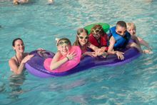 The Hilda and Daly families from Dublin, Ireland take in an afternoon swim at the Rosen Inn at Pointe Orlando’s pool.