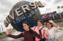 To commemorate the start of their day at Universal Orlando Resort, Olga Rodiguez and Ambar and Michell Cuichan from Guayaquil, Ecuador pose for a selfie.
