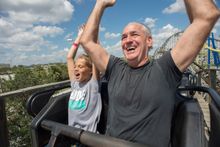 Visitors Luke Spinelli and Bret Boeddinhaus enjoy a ride on White Lightning at Fun Spot Orlando.