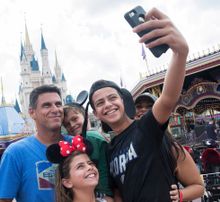 The Sussman family from Weston, Florida snaps a fun selfie in front of the iconic Cinderella Castle at Walt Disney World Resort, just days after the storm.