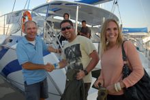 Peter Lynch with regular passengers Tim and Janette Irwin 