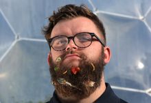 Inspired by Roald Dahl’s The Twits, Eden Project narrator Jake Proffitt poses with a beard full of discarded food including a sardine tail, some edible insects and a blob of Stilton cheese.