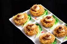Crispy noodle, scallop, seasonal greens with X.O. sauce