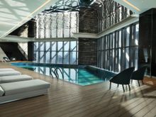 Indoor heated pool with saline water, tiles make up 'Ombak' artwork by local artist 