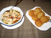 Macanese cuisine - garlic prawns and bacalhau (salted cod fritters)