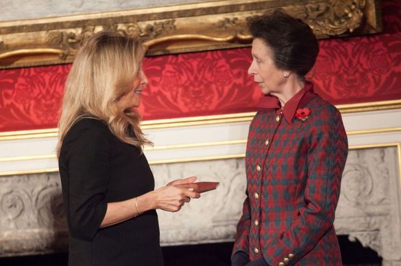 Princess Anne presenting Victoria Tollman, Executive Director of Red Carnation Hotels, with a Princess Royal Training Award 2017 