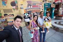Sheraton Grand Macao Chief Concierge Mark Chang snaps a selfie in front of  Macau Creations in Taipa Village