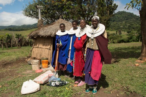 Maasai women in Tanzania welcoming G Adventures travelers