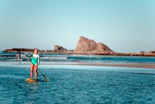 Gold Coast super fish Karla Gilbert is a true believer in the power of the ocean - swimming in it or SUP-ing on it