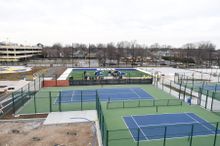 Aerial overview of tennis and football
