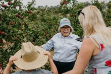 Ann Lyster, grower and Director of Fruit West Co-operative Ltd, was on hand to show the Walsh family around the orchard_photo credit Sophie Brockmann 