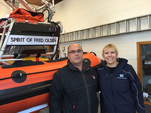 Fred. Olsen Cruise Lines' Rachael Jackson and Sandy Murray of Kyle of Lochalsh RNLI celebrate the two organisations' long-standing partnership, with Atlantic 85-class lifeboat 'Spirit of Fred. Olsen' 