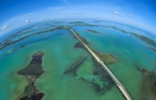 A full-frame fisheye lens helps to provide a unique view of the Florida Keys' Overseas Highway as it bisects the Atlantic Ocean,