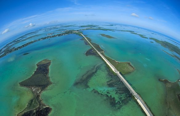 A full-frame fisheye lens helps to provide a unique view of the Florida Keys' Overseas Highway as it bisects the Atlantic Ocean,