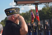 Veteran Don Bailey salutes during the presentation of colors at Clarksville's Welcome Home Veterans Celebration.