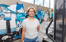 Bao Ho with her new mural at TRYP Fortitude Valley Hotel, Brisbane