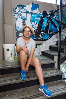 Bao Ho with her new mural at TRYP Fortitude Valley Hotel, Brisbane