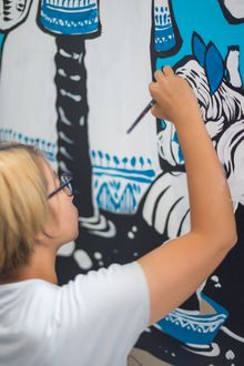 Bao Ho with her new mural at TRYP Fortitude Valley Hotel, Brisbane