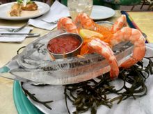 Fresh Gulf shrimp served in an ice boat is a favorite appetizer at The Dock at Crayton Cove, a local favorite among Naples' many locally-owned restaurants.