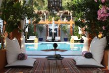 Relax on a sun lounger by the Retreat's beautiful pool