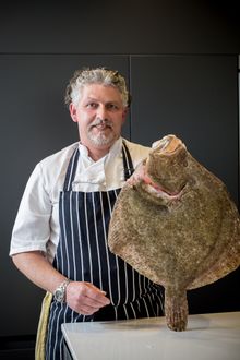 Chef Ben Tunnicliffe brings a giant turbot to the dinner party experience available exclusively to Cornish Gems’ luxury self-catering guests.