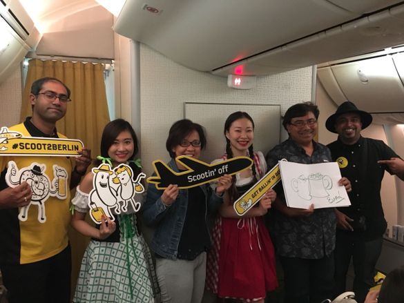 Vinod Kannan, COO Scoot (LH) welcomes passengers and crew on board to Berlin