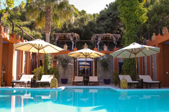 Relax on a sun lounger by the Retreat's beautiful pool