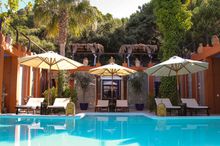 Relax on a sun lounger by the Retreat's beautiful pool
