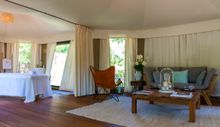 Our treatment rooms are beautifully appointed in cream and rich-toned wood