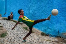 Young footballer in an Ethiopian village. Ye Hongbin/tpoty.com