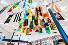 Archie  Moore,   United  Neytions ,  2018 ,   i nstallation  for  T1  Interna tional   Terminal,  Sydney  Airport,   MCA  &   Sydney  Airport   Commission ,  2018 , photograph : Anna Kucera
