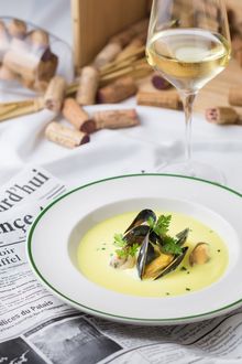 Black mussel soup with white wine, cream, saffron and croutons.
