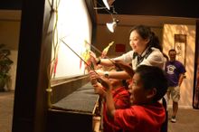 Shadow puppets brighten faces at world's largest children's museum.