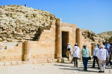 Guests enjoying special access at a tomb in Saqqara, Egypt