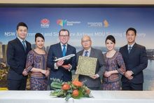 (third from left) Minister Marshall and Mr Yeoh Phee Teik, Singapore Airlines Vice President Customer Experience, together with Singapore Airlines cabin crew, at the signing of the MoU. 