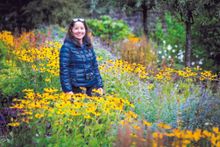 A solo traveler exploring the gardens of Ashford Castle in Ireland